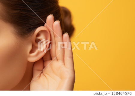 Woman's hand cupped to her ear to eavesdrop and listen to a private conversation 138464570