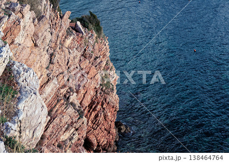 Rugged Cliffside Overlooking Blue Sea: Dramatic Coastal Landscape, Clear Water, and Natures Power Rugged Cliffside Overlooking Blue Sea: Dramatic Coastal Landscape, Clear Water, and Natures Power 138464764