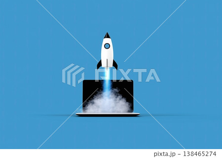 A startup rocket launching from a laptop screen symbolizes technology, innovation and business growth on a blue backdrop. 138465274