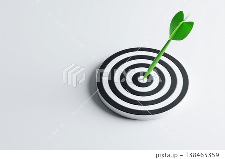 Green arrow hits the bullseye on a target, symbolizing goal achievement and success with focus and precision. Green arrow hits the bullseye on a target, symbolizing goal achievement and success with focus and precision. 138465359