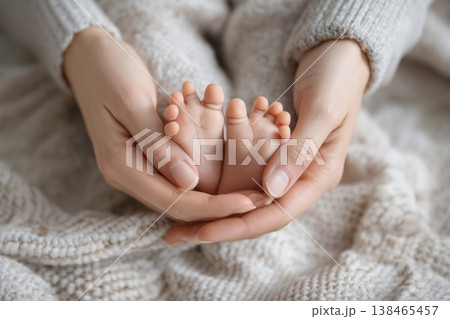 Gentle hands cradle tiny baby feet on a soft knit blanket, symbolizing love, newborn innocence, and tender beginnings. Gentle hands cradle tiny baby feet on a soft knit blanket, symbolizing love, newborn innocence, and tender beginnings. 138465457