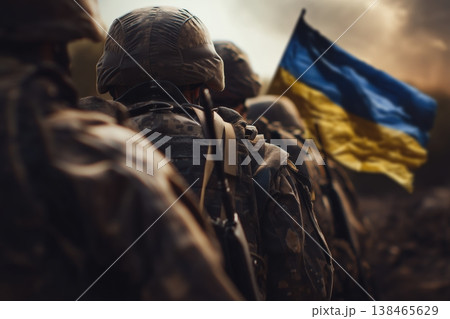 Ukrainian soldiers stand strong with their national flag in a powerful display of resilience and patriotism in wartime. 138465629