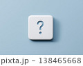 Question mark sign on a white cube against a blue background showcases problem solving and unanswered queries. 138465668