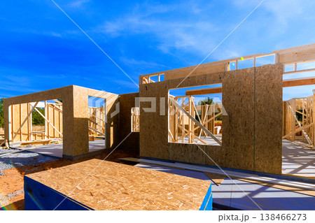 Workers are building new structure using wooden beams frames in build process Workers are building new structure using wooden beams frames in build process 138466273
