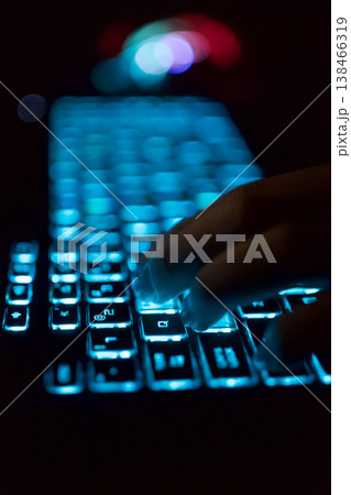 Working on a neon computer keyboard with colored backlighting. Selected focus. Computer video games, hacking, technology, internet concept. Selected focus. Working on a neon computer keyboard with colored backlighting. Selected focus. Computer video games, hacking, technology, internet concept. Selected focus. 138466319