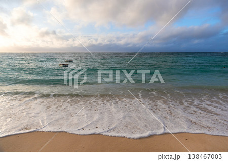Gentle waves wash over a sandy shoreline, Seychelles 138467003