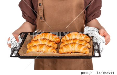 Baker holding tray with fresh croissants Baker holding tray with fresh croissants 138468544