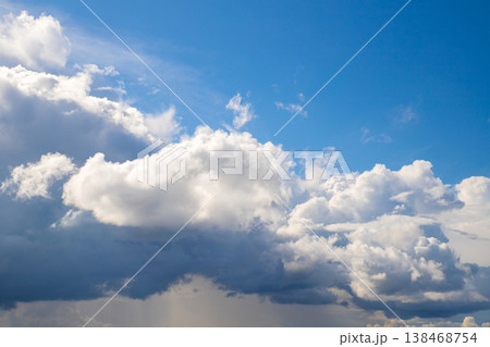 Fluffy white cloud and blue sky above. Thundercloud and rain below. Divine heaven 138468754