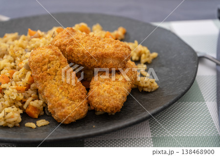 Turmeric Rice Bowl with Crunchy Fish Fingers Turmeric Rice Bowl with Crunchy Fish Fingers 138468900