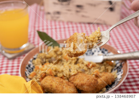 Savory Turmeric Rice with Crunchy Fish Savory Turmeric Rice with Crunchy Fish 138468907