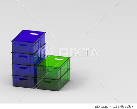 Stacked plastic storage boxes in blue and green with copy space for organization concept 138469267