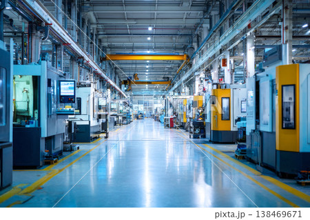 Bright, clean manufacturing hall with rows of interconnected automated machines operating production workflows Bright, clean manufacturing hall with rows of interconnected automated machines operating production workflows 138469671