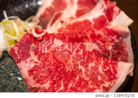 Sliced Negidare wagyu served on plate, a Wagyu beef with a soy based sauce made with green onions or scallions Sliced Negidare wagyu served on plate, a Wagyu beef with a soy based sauce made with green onions or scallions 138470250