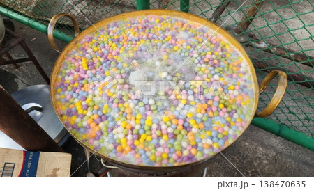 Colorful Thai Glutinous Rice Balls (Bua Loi) Boiling in a Traditional Brass Pan Colorful Thai Glutinous Rice Balls (Bua Loi) Boiling in a Traditional Brass Pan 138470635