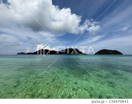 Tropical Paradise Islands with Crystal Clear Turquoise Sea and Blue Sky Tropical Paradise Islands with Crystal Clear Turquoise Sea and Blue Sky 138470641