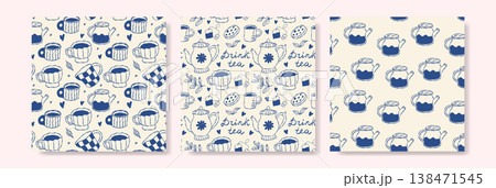 Vintage tea themed patterns with blue teapots and flowers on cream backgrounds Vintage tea themed patterns with blue teapots and flowers on cream backgrounds 138471545