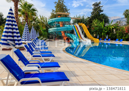 Chaise longues near a swimming pool. Concept of spa, rest, relaxation, holidays, resort 138471811