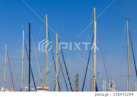 Masts of sailboats against clear blue sky 138472204