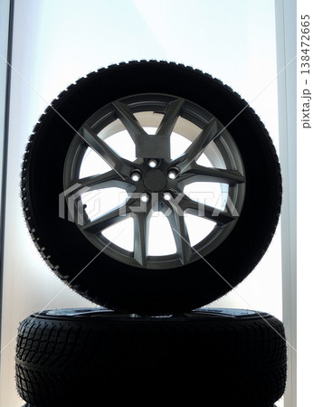 Rack of assembled car wheels with new tires and alloy discs isolated Rack of assembled car wheels with new tires and alloy discs isolated 138472665