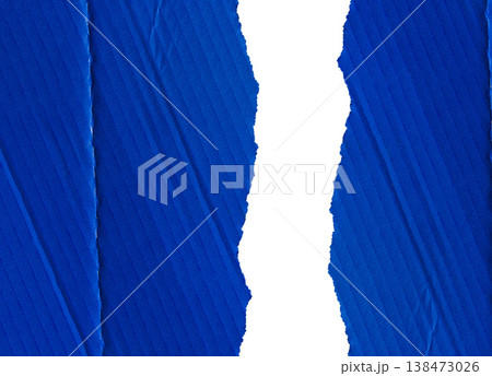 Blue corrugated cardboard with torn edges, divided into two parts Blue corrugated cardboard with torn edges, divided into two parts 138473026