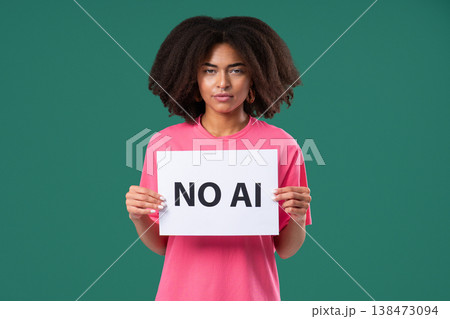 African Woman Holds Sign No Ai With Serious Face In Green Studio Visual Protest African Woman Holds Sign No Ai With Serious Face In Green Studio Visual Protest 138473094
