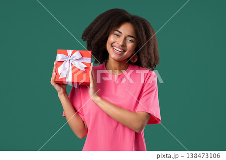 Grateful African Woman With Gift Box On green.Teenager Smiling,Present, Surprise Grateful African Woman With Gift Box On green.Teenager Smiling,Present, Surprise 138473106
