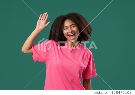 Friendly African Pretty Woman Waving Hand - Hello, Hi. Greetings. Green Studio Friendly African Pretty Woman Waving Hand - Hello, Hi. Greetings. Green Studio 138473108