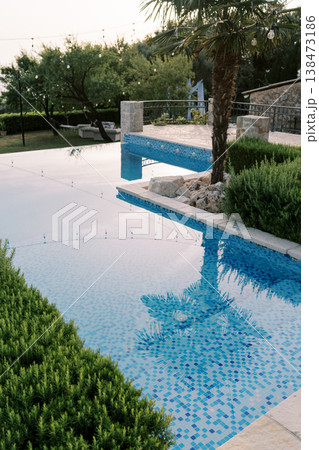 Sophisticated Tropical Oasis Featuring Mosaic Tiles And Tranquil Surroundings 138473186