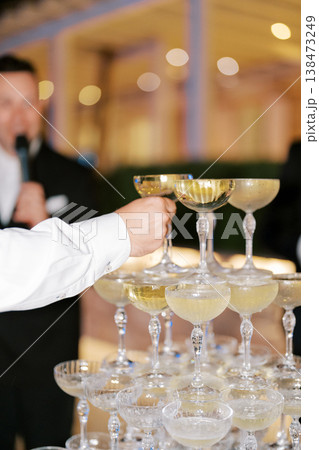 Luxurious Event Featuring Bubbly Being Served In Grand Ballroom 138473249
