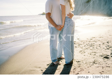 Relaxed Individuals Sharing Intimate Connection By Tranquil Shoreline 138473286