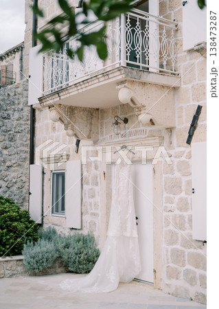 Sophisticated Wedding Gown Suspended Gracefully In Warm Daylight Sophisticated Wedding Gown Suspended Gracefully In Warm Daylight 138473287