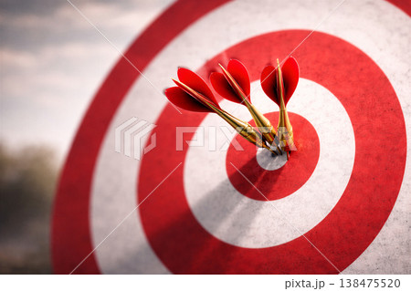 Three Darts Hitting the Red Bullseye Target 138475520