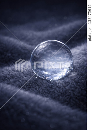 Crystal Sphere Resting on Velvet Ripples 138475616