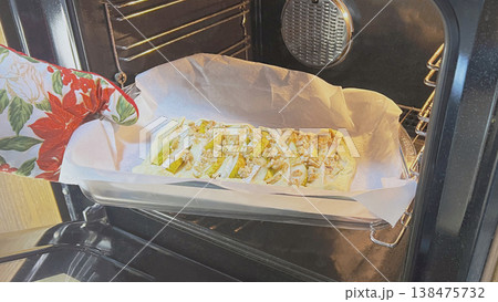 Tofu being baked in an oven with seasoning on parchment Tofu being baked in an oven with seasoning on parchment 138475732