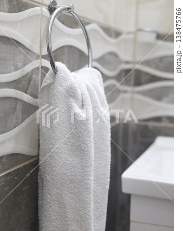 White Towel Hanging on Bathroom Ring White Towel Hanging on Bathroom Ring 138475766