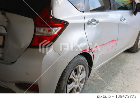 Car with Rear Side Damage and Red Scratch 138475775