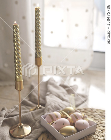 Golden Twisted Candles With Pastel Easter Eggs 138475786
