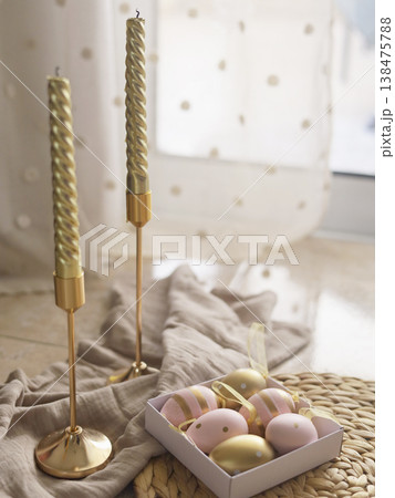Golden Taper Candles And Pastel Easter Eggs 138475788