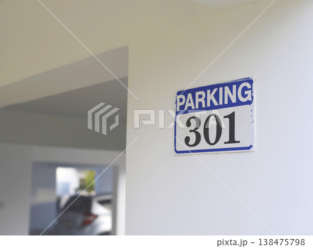 Blue Parking Sign On Interior Wall 138475798