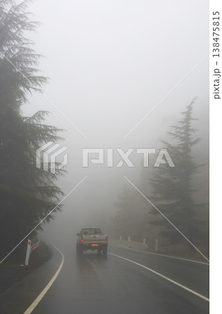 Lonely Truck Driving Through Thick Fog On Road 138475815