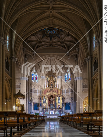 Ornate Gothic Interior of the Sacred Heart Church With Grand Altar, Stained Glass Windows And Long Nave, Malaga Ornate Gothic Interior of the Sacred Heart Church With Grand Altar, Stained Glass Windows And Long Nave, Malaga 138476068