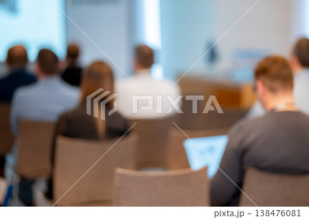 Blurred view of business people attending a conference 138476081
