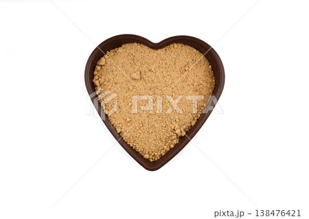Nutritious Oleaster Seed Powder in Heart Shaped Wooden Bowl on White Background for Heart Health 138476421