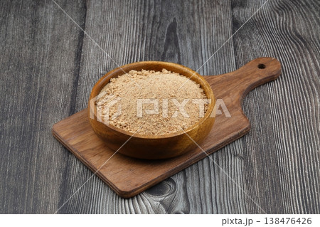 Organic Oleaster Seed Powder in a Rustic Wooden Bowl on a wooden Background for Healthy Living Organic Oleaster Seed Powder in a Rustic Wooden Bowl on a wooden Background for Healthy Living 138476426