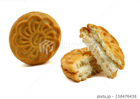 Delicious Crispy Sandwich Biscuit with Smooth Vanilla Cream Filling Isolated on White Background Delicious Crispy Sandwich Biscuit with Smooth Vanilla Cream Filling Isolated on White Background 138476438