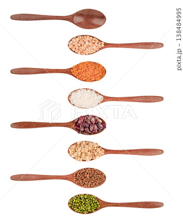 Set of different cereals in wooden spoons isolated on white background Set of different cereals in wooden spoons isolated on white background 138484995