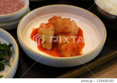 Korean radish kimchi cubes served with spicy sauce 138486385
