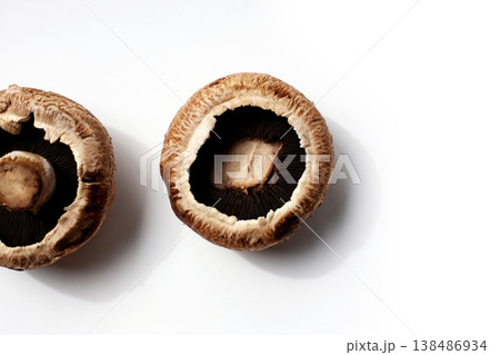 Fresh portobello mushrooms with visible gills underneath. Fresh portobello mushrooms with visible gills underneath. 138486934
