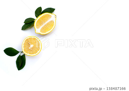 Fresh lemon with green leaves on white. 138487166