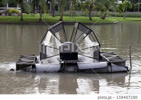 Water aerator machine operating in park pond 138487280